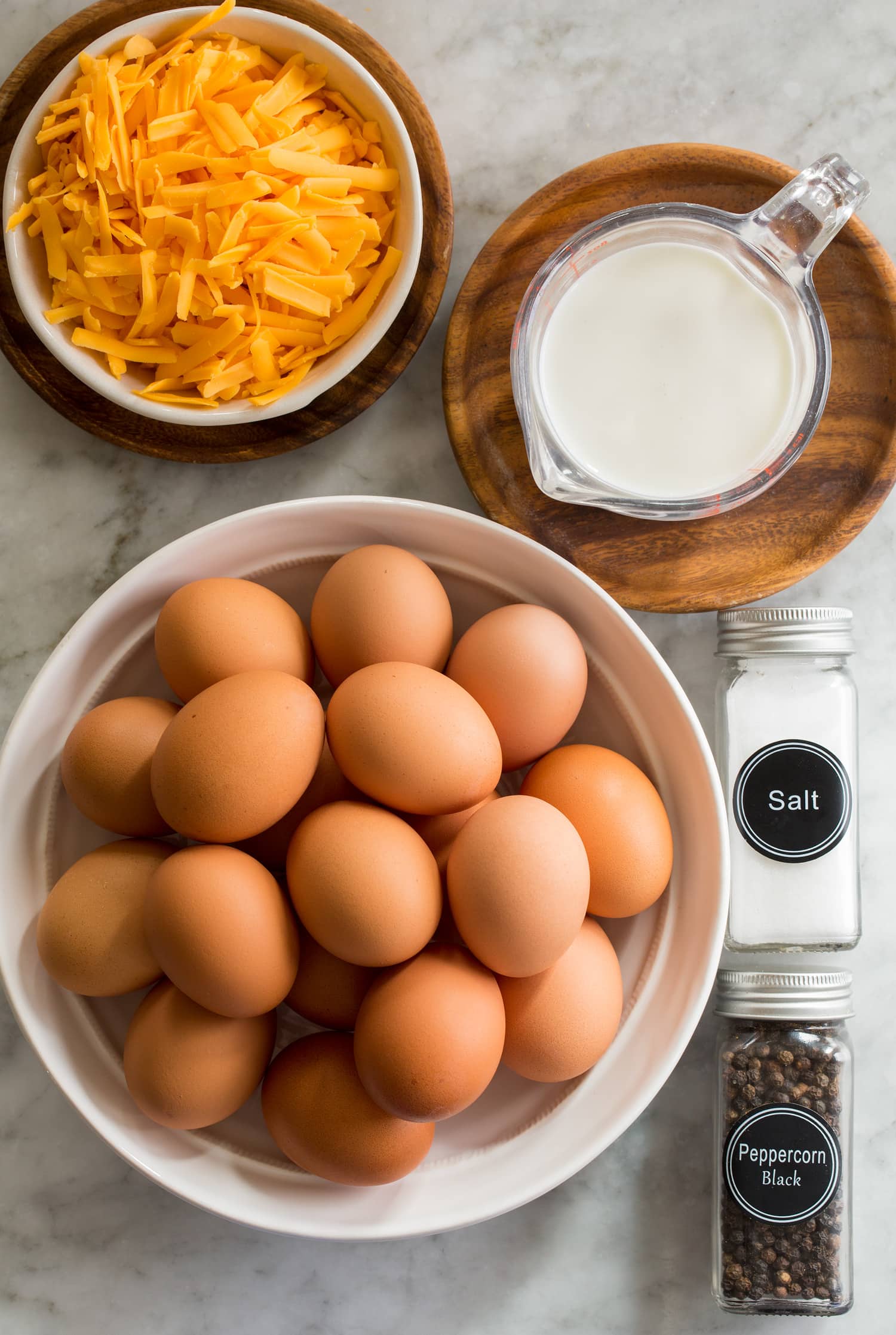 Photo of ingredients including eggs, half and half, cheddar, salt and pepper.