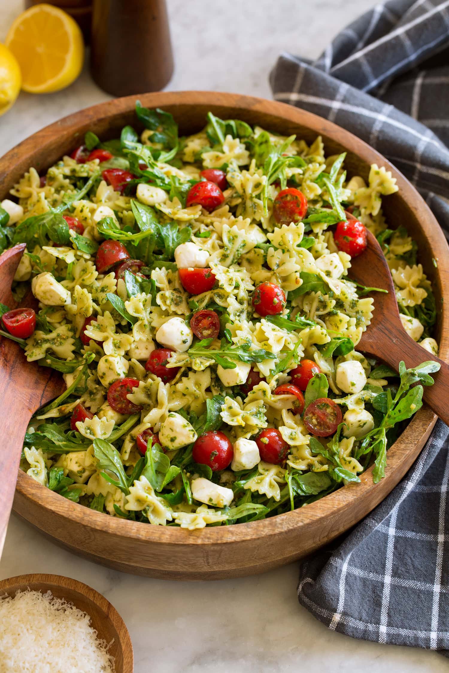 Pesto pasta salad with homemade pesto, baby arugula, grape tomatoes and fresh mozzarella pearls. 