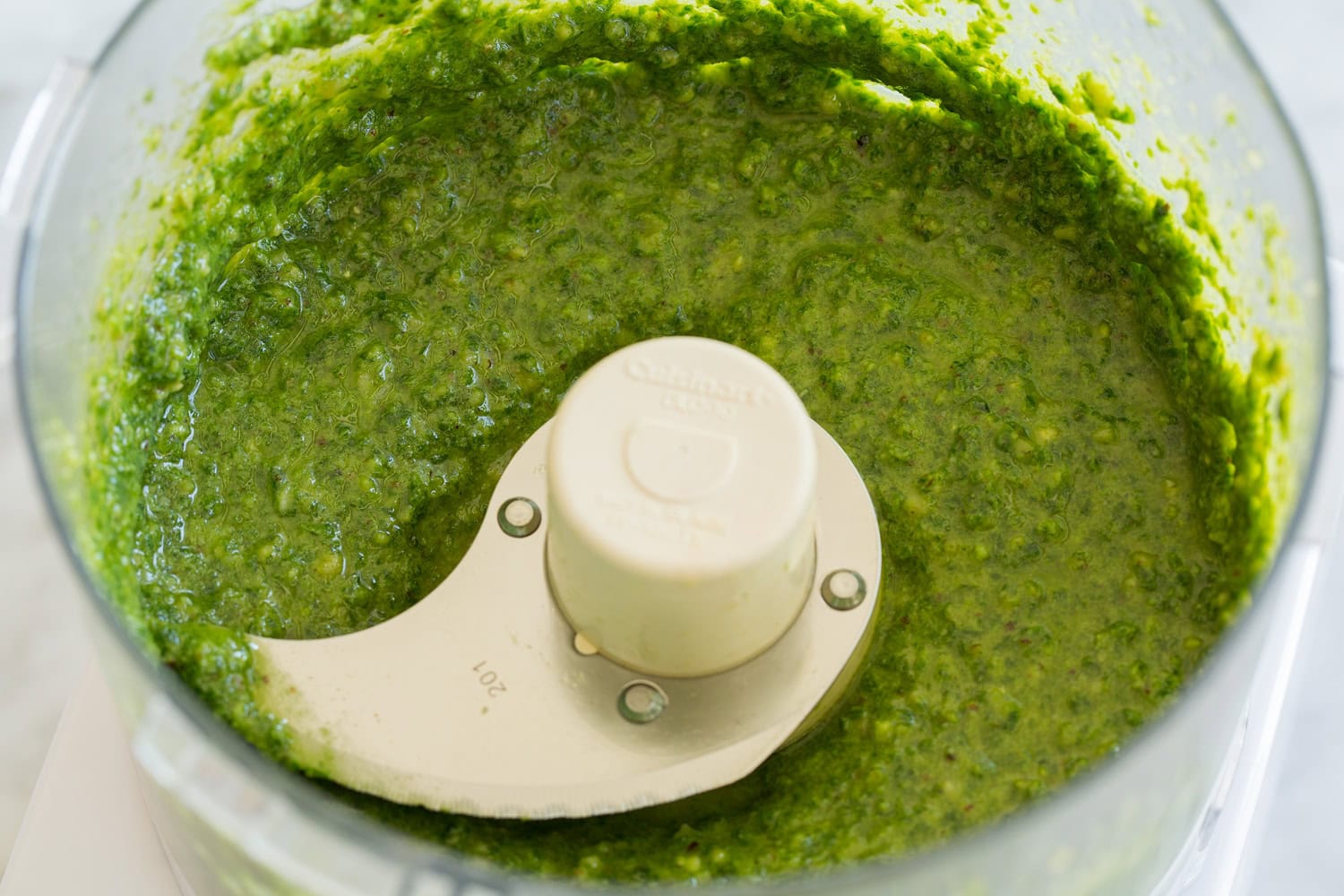 Completed basil pesto in a food processor.